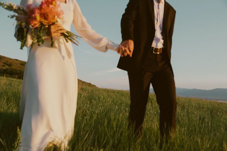 Close detail of a couple holding hands